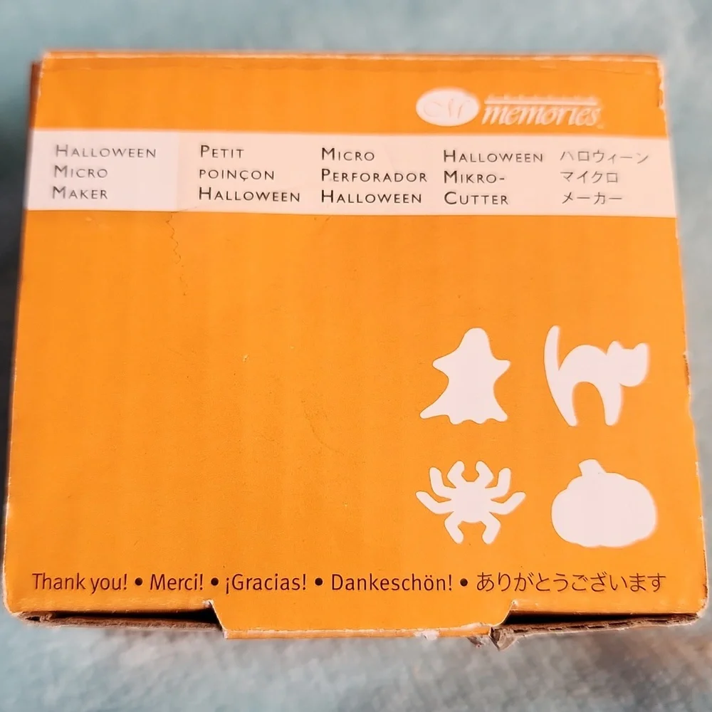 Creative Memories Halloween Micro Maker and 10 sheets of black 8x8 cardstock.